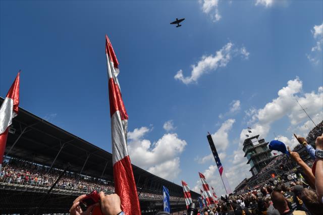 P-51 Mustang flying over Indianapolis Motor Speedway for the 100th Running of the Indianapolis Motor Speedway. -- Photo by: Chris Owens