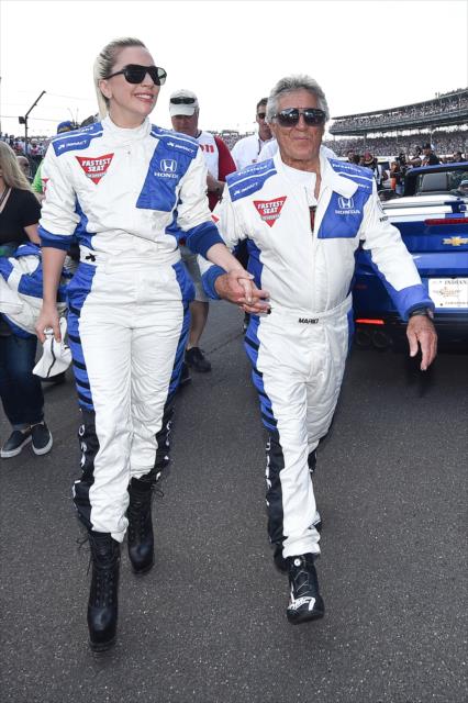 Lady Gaga and Mario Andretti heading out to for the Honda Fastest Seat in Sports for the 100th Running of the Indianapolis 500. -- Photo by: Chris Owens