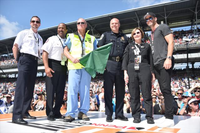 Chris Pine receives the green flag prior to the 100th Running of the Indy 500 presented by PennGrade Motor Oil -- Photo by: Dana Garrett