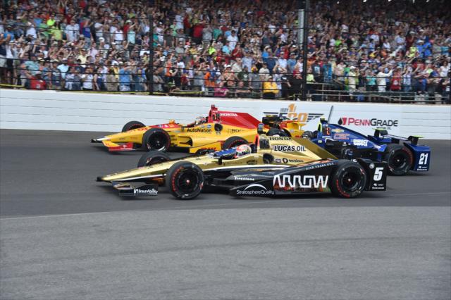 James Hinchcliffe, Josef Newgarden and Ryan Hunter-Reay three wide at Indianapolis Motor Speedway for the 100th Running of the Indianapolis 500. -- Photo by: Dana Garrett