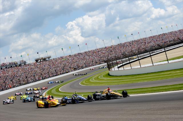 Forming the famous 11 rows of 3 to start the 100th Indianapolis 500 -- Photo by: Doug Mathews