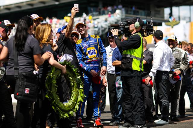 Alexander Rossi and the Andretti Herta Autosport team celebrate victory in the 100th Indianapolis 500 on the famous yard of bricks -- Photo by: David Yowe
