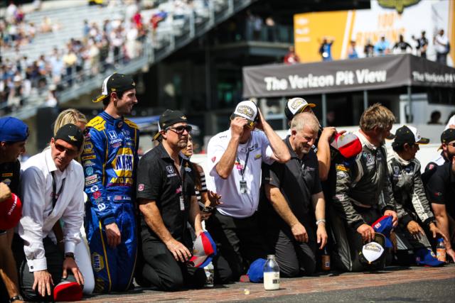 Alexander Rossi and the Andretti Herta Autosport team ready to kiss the bricks following their win in the 100th Indianapolis 500 -- Photo by: David Yowe
