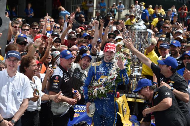 Alexander Rossi celebrates in Victory Circle after winning the 100th Indianapolis 500 -- Photo by: John Cote