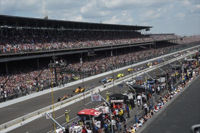 The green flag waves for the 100th Running of the Indianapolis 500 at a sold out Indianapolis Motor Speedway. -- Photo by: Jim Haines