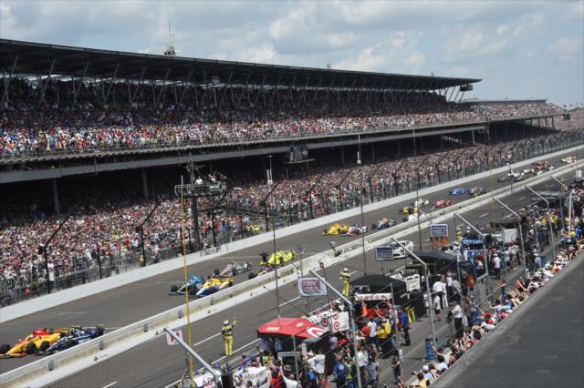 The field taking the green flag in front of a sellout crowd for the 100th Running of the Indianapolis 500. -- Photo by: Jim Haines