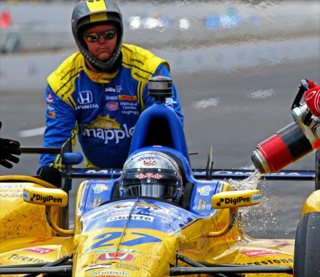 Marco Andretti gets a splash of fuel on pit lane during the 100th Indianapolis 500 -- Photo by: Mike Harding