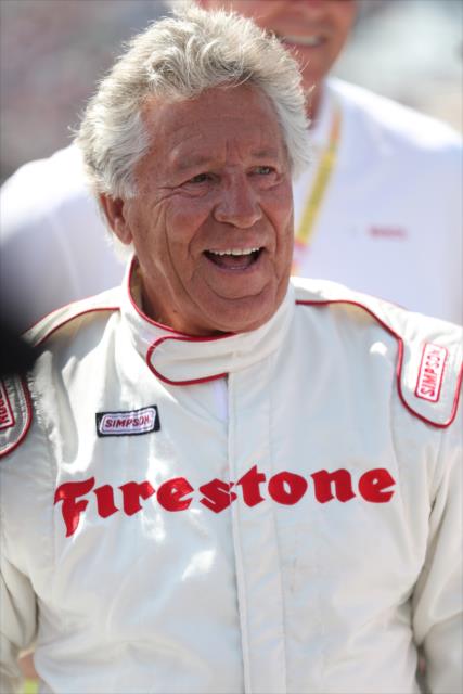 Legend Mario Andretti poses for a photo during pre-race festivities for the 100th Indianapolis 500 -- Photo by: Shawn Gritzmacher