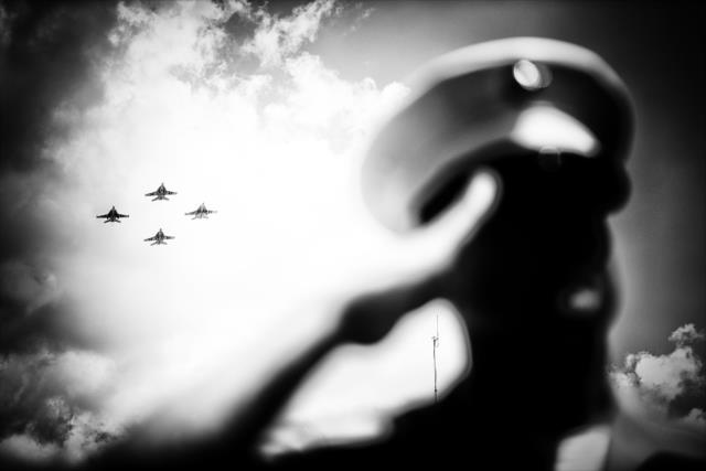 The military flyover during pre-race festivities for the 100th Indianapolis 500 -- Photo by: Shawn Gritzmacher