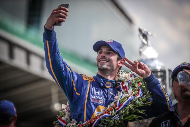 Alexander Rossi with a celebratory selfie in Victory Circle following his win in the 100th Indianapolis 500 -- Photo by: Shawn Gritzmacher