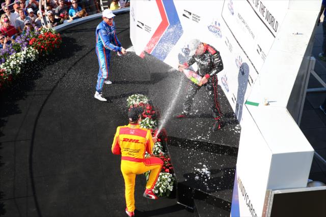Scott Dixon and Ryan Hunter-Reay spray Will Power with champagne -- Photo by: Bret Kelley