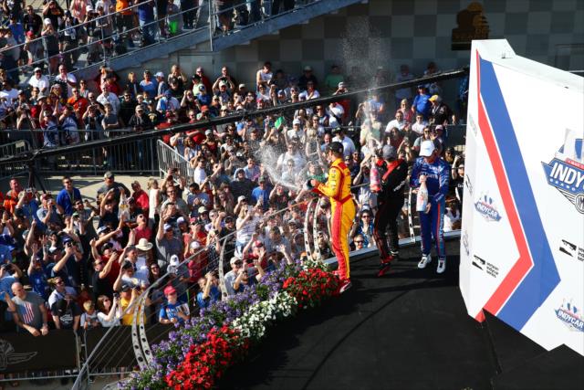 Ryan Hunter Reay, Will Power and Scott Dixon spray fans with champagne -- Photo by: Bret Kelley