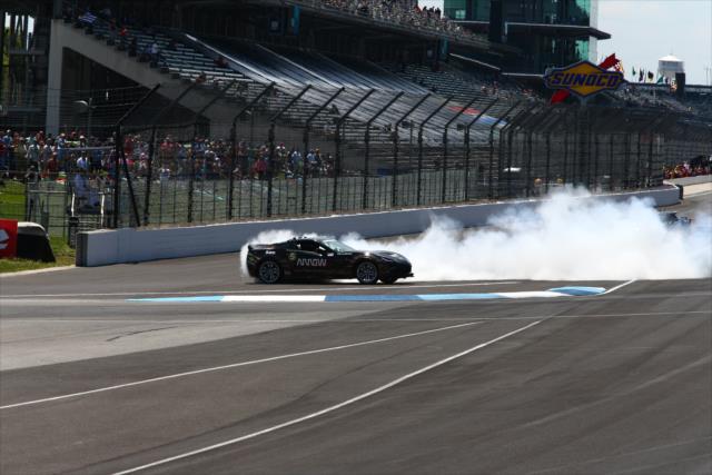 Sam Schmidt does a burnout following his race against Mario Andretti in semi-autonomous vehicles -- Photo by: Bret Kelley