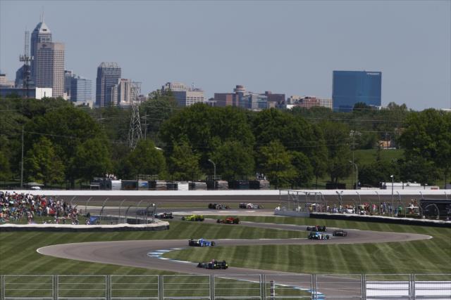 The field rolls through Turns 7-8-9-10 during the INDYCAR Grand Prix at the Indianapolis Motor Speedway -- Photo by: Chris Jones