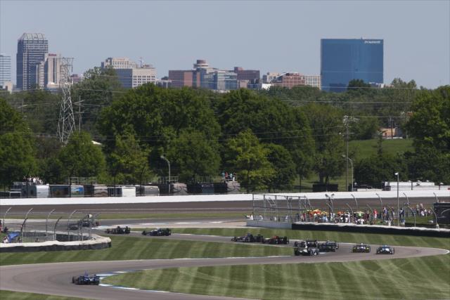 The field streams through Turns 8-9-10 during the start of the INDYCAR Grand Prix at the Indianapolis Motor Speedway -- Photo by: Chris Jones