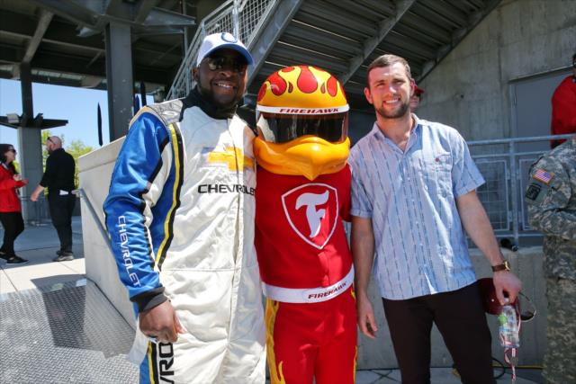 Robert Mathis and Andrew Luck pose with the Firestone Firehawk before the start of the INDYCAR GP -- Photo by: Chris Jones
