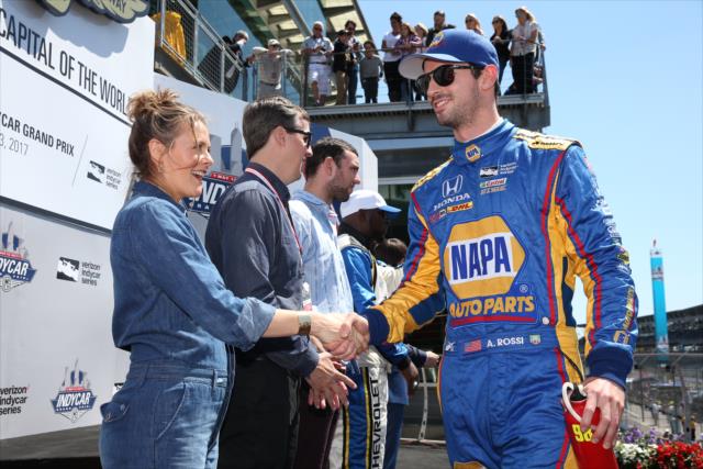 Alexander Rossi shakes the hand of Alicia Silverstone before the start of the INDYCAR GP race -- Photo by: Chris Jones
