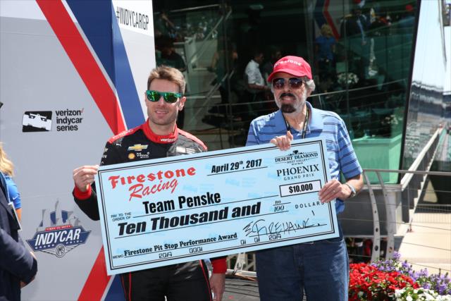 Will Power poses with his P1 check before the INDYCAR GP race -- Photo by: Chris Jones