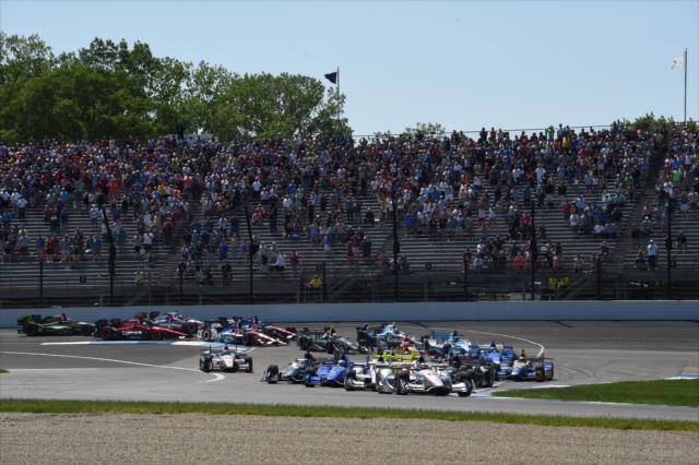 Cars navigate the turns during the INDYCAR GP -- Photo by: Jim Haines