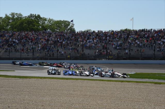 Cars navigate the track during the INDYCAR GP -- Photo by: Jim Haines