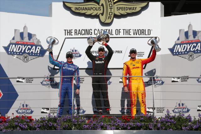 Will Power, Scott Dixon, and Ryan Hunter-Reay hoist their trophies in Victory Circle following the INDYCAR Grand Prix -- Photo by: Joe Skibinski