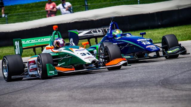 Nicolas Dapero passes Zachary Claman De Melo during the Indy Lights race -- Photo by: Karl Zemlin