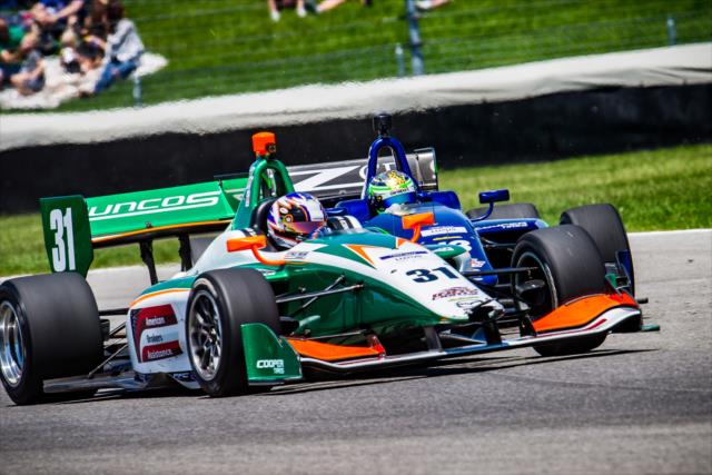 Nicolas Dapero passes Zachary Claman De Melo during the Indy Lights race -- Photo by: Karl Zemlin