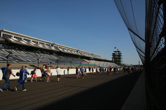 Fans walk the Indianapolis Motor Speedway frontstretch following the INDYCAR Grand Prix at the Indianapolis Motor Speedway -- Photo by: Matt Fraver