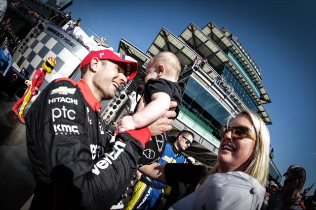 Will Power celebrates in victory lane with his new son Beau -- Photo by: Shawn Gritzmacher