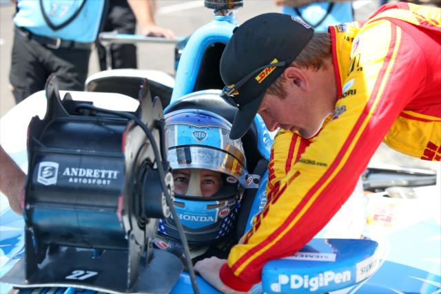 Ryan Hunter-Reay leans in to chat with Marco Andretti on pit lane during practice for the 101st Indianapolis 500 -- Photo by: Chris Jones