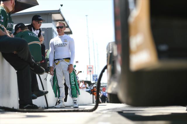 Ed Carpenter chats along pit lane during practice for the 101st Indianapolis 500 -- Photo by: Chris Owens
