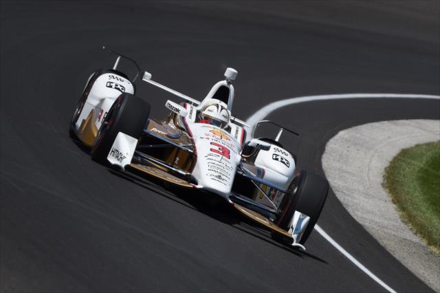 Helio Castroneves flies through Turn 1 during practice for the 101st Indianapolis 500 -- Photo by: Chris Owens