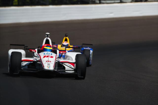 Sebastien Bourdais leads Alexander Rossi out of Turn 3 during practice for the 101st Indianapolis 500 -- Photo by: David Yowe