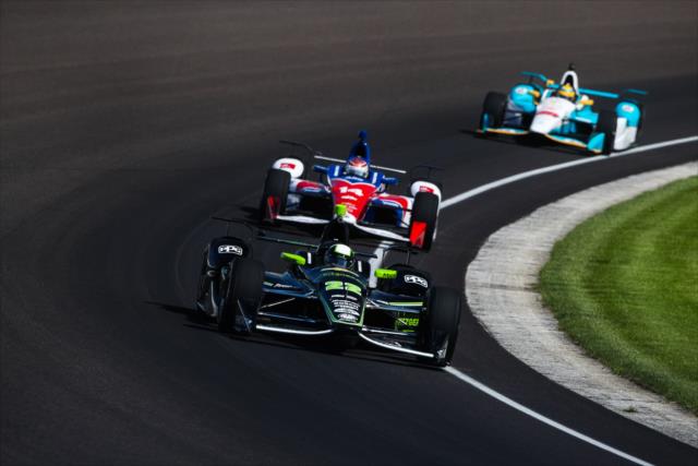 Juan Pablo Montoya leads a group through Turn 3 during practice for the 101st Indianapolis 500 -- Photo by: David Yowe