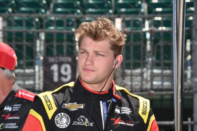 Sage Karam waits along pit lane prior to practice for the 101st Indianapolis 500 -- Photo by: Jim Haines