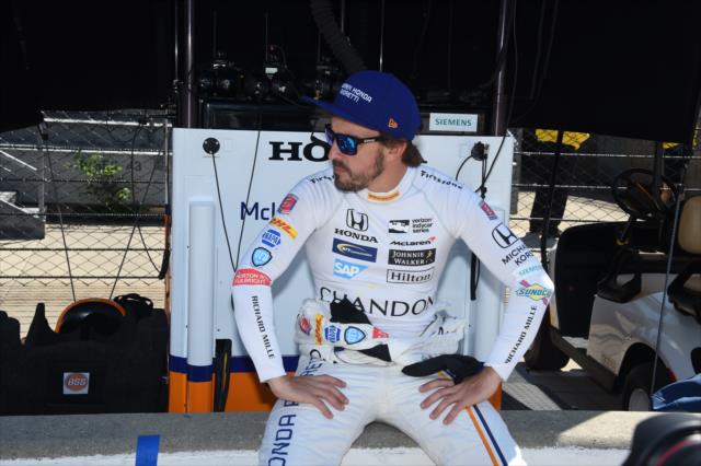 Fernando Alonso looks down pit lane from his stand prior to practice for the 101st Indianapolis 500 -- Photo by: Jim Haines