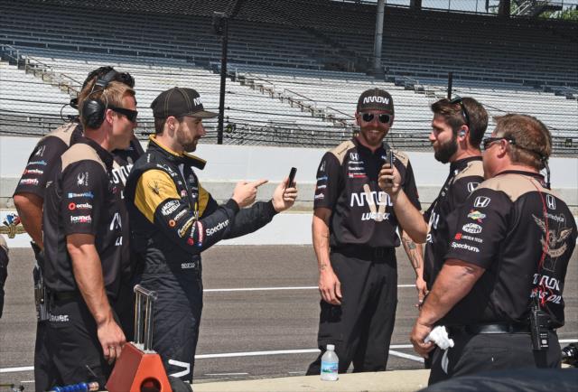 James Hinchcliffe records a video with his team on pit lane prior to practice for the 101st Indianapolis 500 -- Photo by: Jim Haines