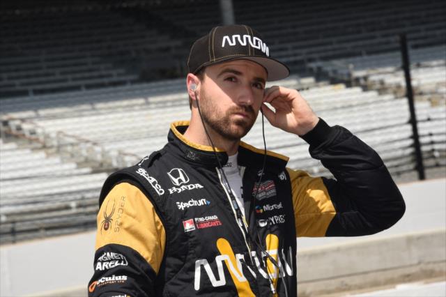 James Hinchcliffe sets his earpieces along pit lane prior to practice for the 101st Indianapolis 500 -- Photo by: Jim Haines