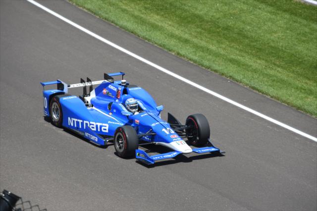 Tony Kanaan makes his entrance into Turn 1 during practice for the 101st Indianapolis 500 -- Photo by: Jim Haines