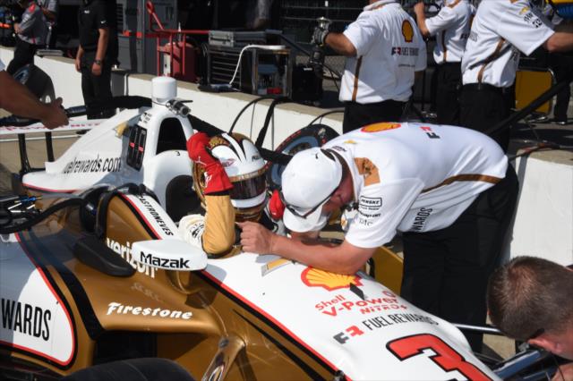 Helio Castroneves gets strapped into his No. 3 Shell Rewards Chevrolet on pit lane during practice for the 101st Indianapolis 500 -- Photo by: Jim Haines