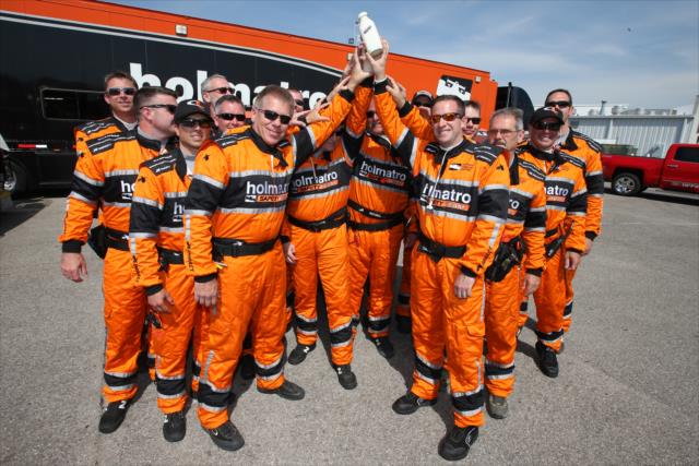 The Holmatro Safety Team hoist a commemorative milk bottle at the Indianapolis Motor Speedway -- Photo by: Joe Skibinski