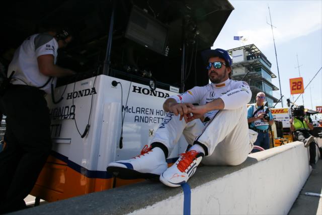 Fernando Alonso sits along pit lane prior to practice for the 101st Indianapolis 500 -- Photo by: Joe Skibinski