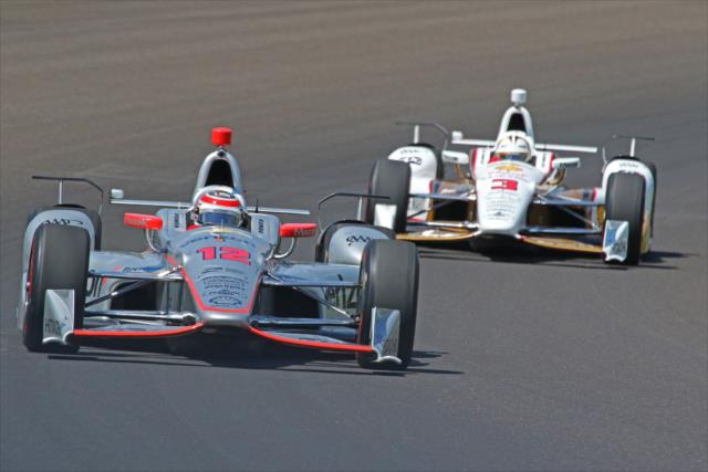 Will Power and Helio Castroneves pair up through Turn 1 during practice for the 101st Indianapolis 500 -- Photo by: Mike Harding