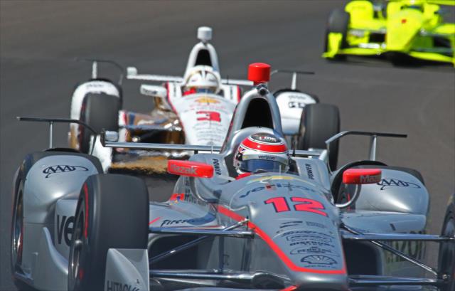 Will Power, Helio Castroneves, and Simon Pagenaud soar through Turn 1 during practice for the 101st Indianapolis 500 -- Photo by: Mike Harding