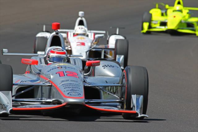 Will Power leads teammates Helio Castroneves and Simon Pagenaud through Turn 1 during practice for the 101st Indianapolis 500 -- Photo by: Mike Harding