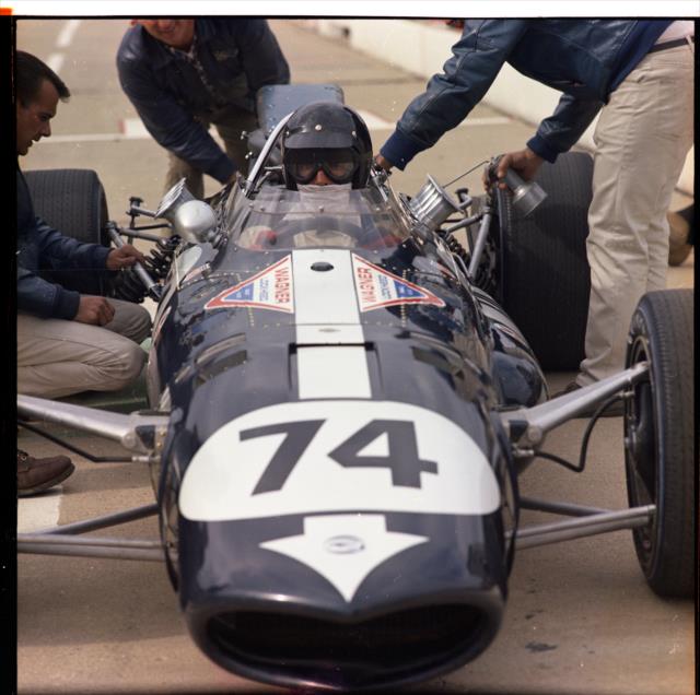 Dan Gurney sits on pit lane prior to practice for the 1967 Indianapolis 500