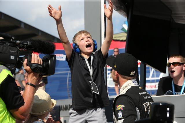 Ed Carpenter's son Ryder celebrates on pit lane after his father, Ed, wins the pole position for the 102nd Indianapolis 500 at the Indianapolis Motor Speedway -- Photo by: Chris Jones