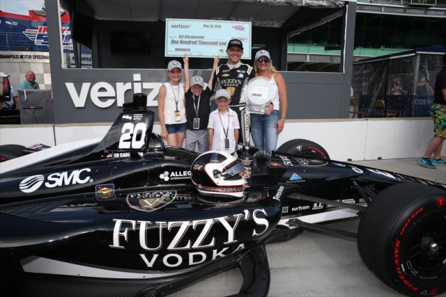 Ed Carpenter and his family on pit lane with the Verizon P1 Award for winning the pole position for the 102nd Indianapolis 500 at the Indianapolis Motor Speedway -- Photo by: Chris Jones