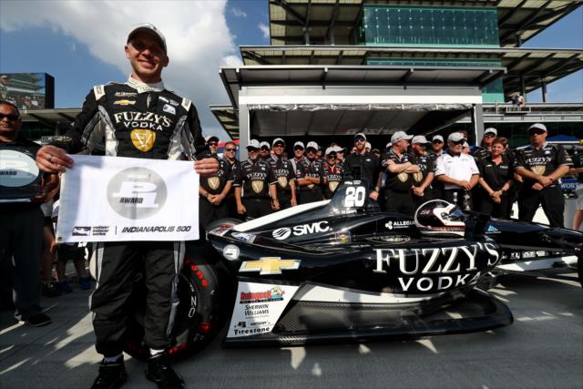 Ed Carpenter with the Verizon P1 Award flag on pit lane after claiming the pole position for the 102nd Indianapolis 500 at the Indianapolis Motor Speedway -- Photo by: Chris Jones