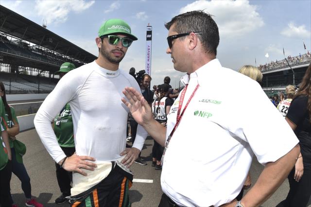 Kyle Kaiser chats with team owner Ricardo Juncos on pit lane prior to his qualification attempt for the 102nd Indianapolis 500 at the Indianapolis Motor Speedway -- Photo by: Chris Owens